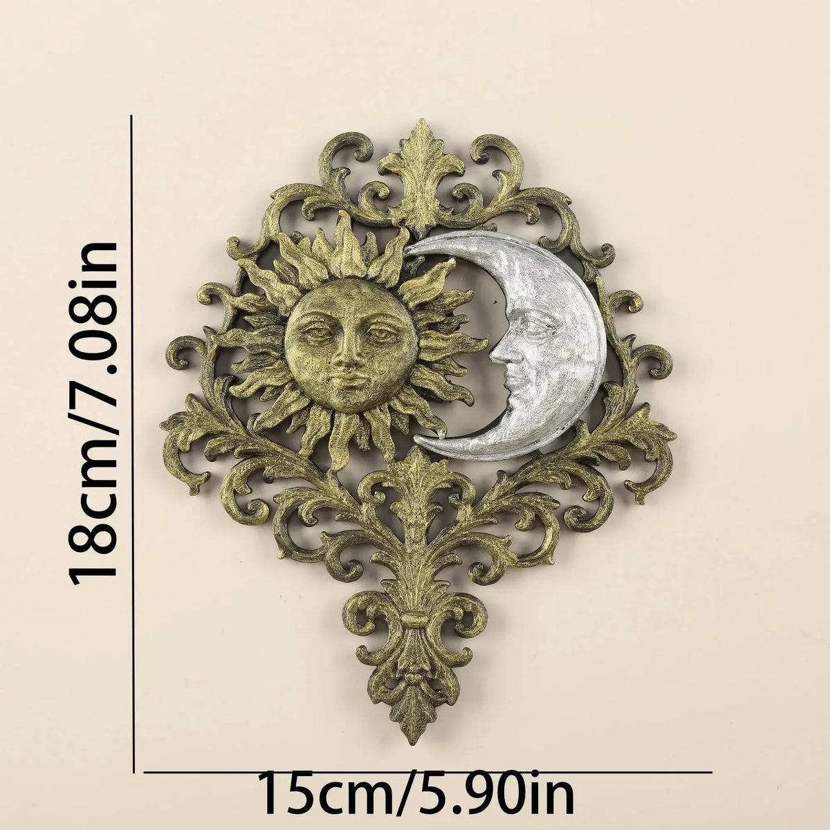 Close-up of the hand-painted scrollwork on the sun and moon wall plaque