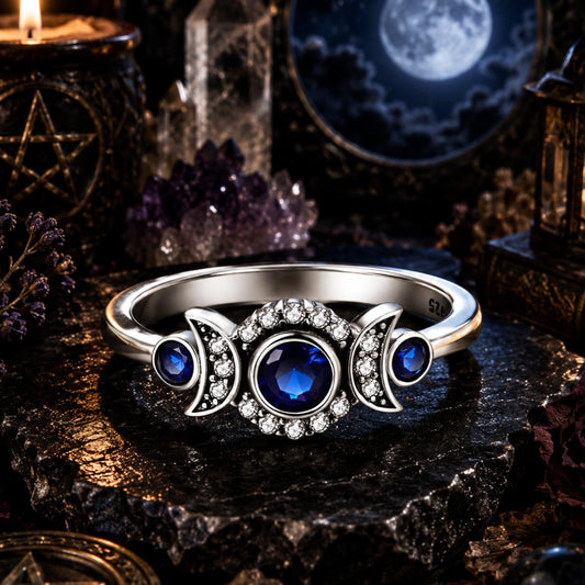 Sterling silver Triple Moon Wiccan ring with a large blue zircon and sparkling clear crystals.