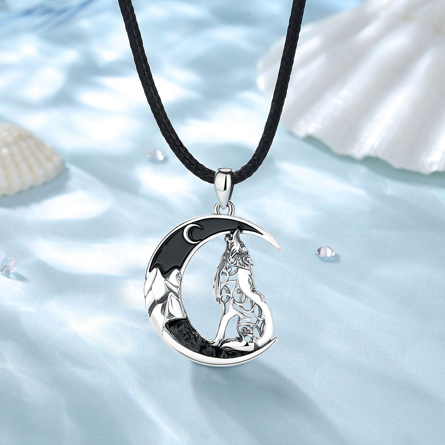 Sterling silver Celtic wolf pendant with black zircon moon on a black cord, 24.6mm x 36.6mm.