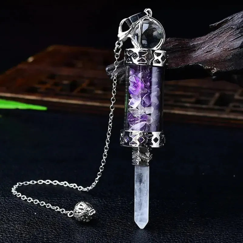 Glass chamber, crystal chips and pointed pendulum with chain: Crystal Chip Glass Bottle Divination Pendulum, featuring a crystal-chip glass bottle with an elongated point and chain.