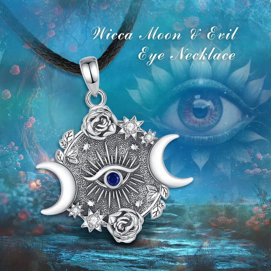 Sterling silver Triple Moon Goddess necklace with Eye of Horus, blue gem, roses, and stars on a black chain.