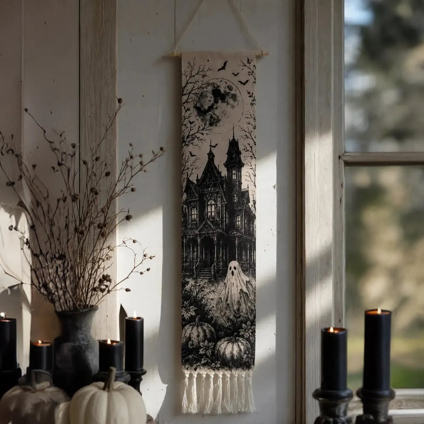 Halloween haunted house tapestry hanging with black candles and white pumpkin