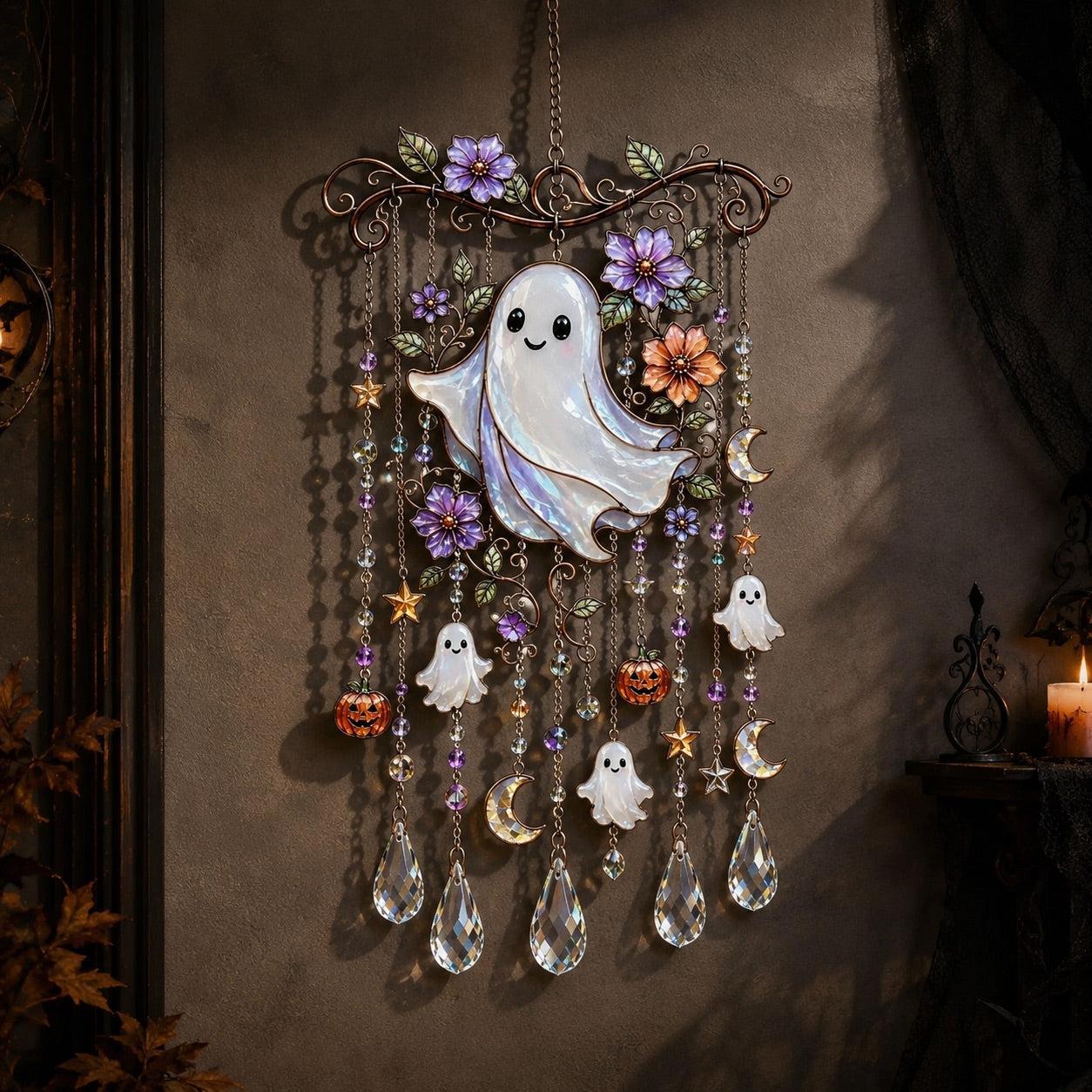 Halloween ghost wind chime suncatcher hanging on wall with candle glow