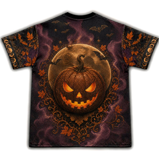 A short-sleeve crewneck t-shirt featuring a detailed Halloween graphic print. The design showcases a glowing jack-o'-lantern pumpkin in the center, set against a full moon and dark purple misty background, with bats and autumn leaves on the sleeves.