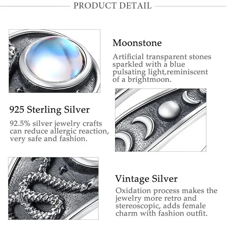 Artificial moonstone and sterling silver ring detail panels