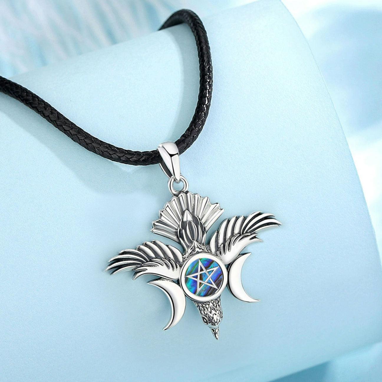 Sterling silver Pentacle Triple Moon Goddess necklace with iridescent abalone inlay on a black cord.