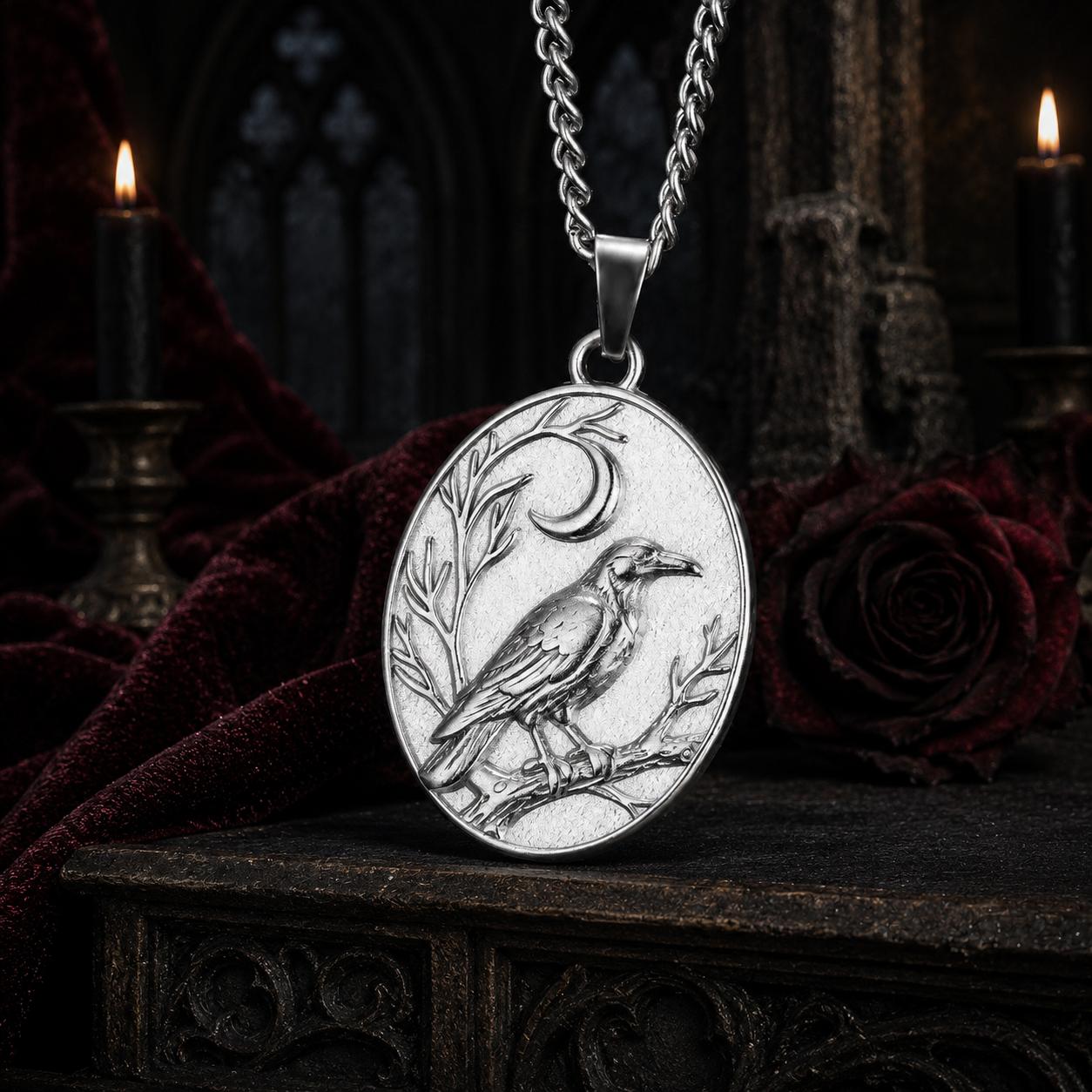 Silver Raven Crescent Moon necklace close-up with detailed crow engraving