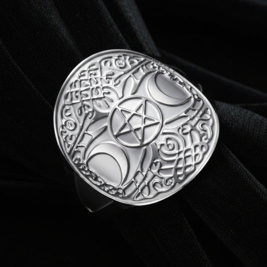 Silver triple moon pentacle ring, macro close-up of Celtic knotwork face design