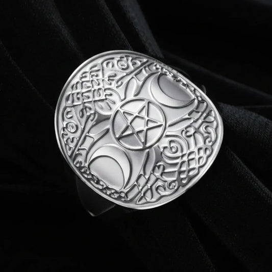 Silver triple moon pentacle ring, macro close-up of Celtic knotwork face design