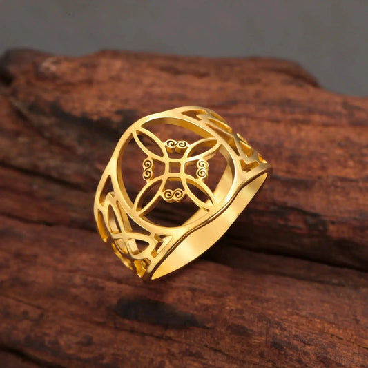 Enchanting gold stainless steel Witch Knot Celtic Pagan ring with intricate knotwork on a rustic wood surface.
