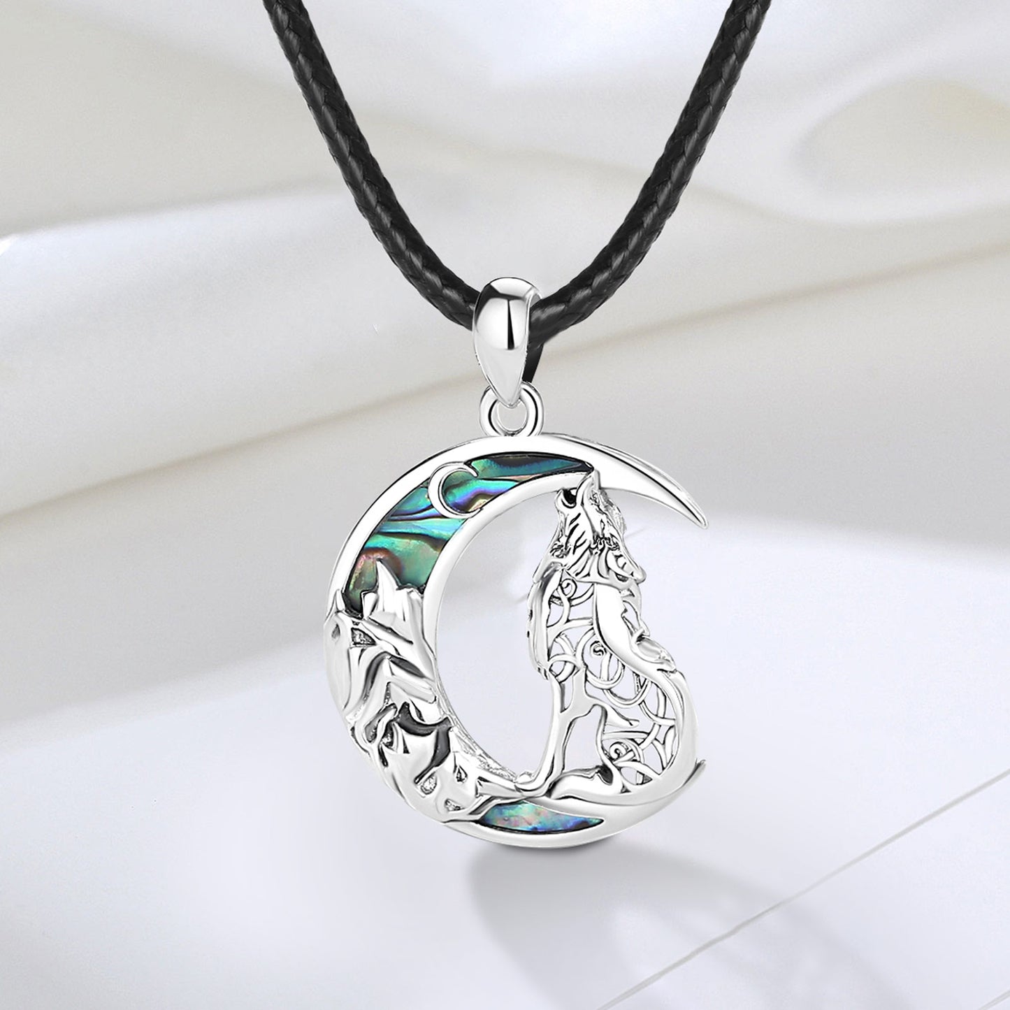 Enchanting 925 Sterling Silver Witchy Wolf Moon Necklace with iridescent abalone inlay on a black cord.