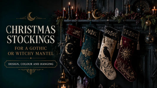 Gothic Christmas stockings with celestial and witchy designs hanging on a dark, festive mantel