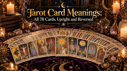 Tarot card meanings banner with a full deck of 78 tarot cards fanned out on a candlelit purple altar cloth