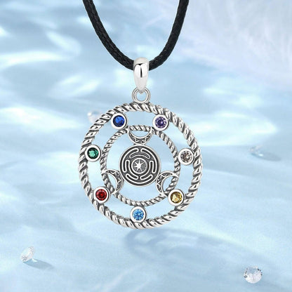 Sterling silver 7 Chakras Hecate Wheel Moon Goddess Wicca Amulet pendant with colorful gemstones on a black cord.