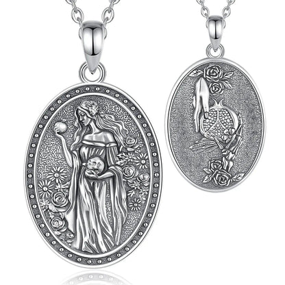 925 sterling silver oval Persephone necklace with goddess holding pomegranate and skull, surrounded by flowers.