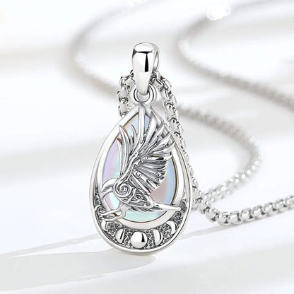 Viking raven rune necklace worn close-up – moonstone crystal Pagan sterling silver pendant