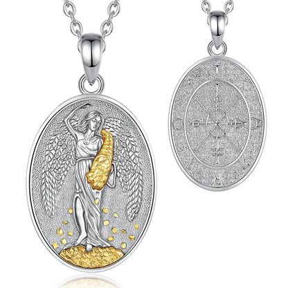 Two views of an oval silver pendant necklace on a white background. The left view shows the front with a silver angel figure holding a golden textured object, and the right view shows the reverse side with an engraved circular design.