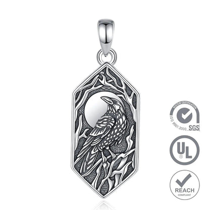 Sterling silver Gothic raven pendant with a crescent moon and tree branches in a hexagonal frame.