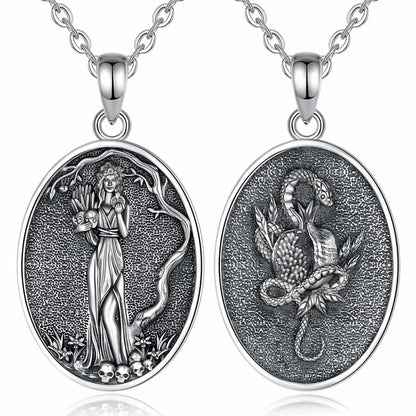 925 sterling silver oval Persephone necklace with a goddess holding pomegranates and skulls, and a snake on the reverse.
