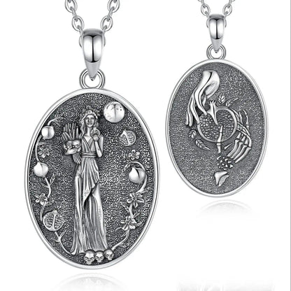925 sterling silver oval Persephone necklace with goddess, pomegranates, and skull details.