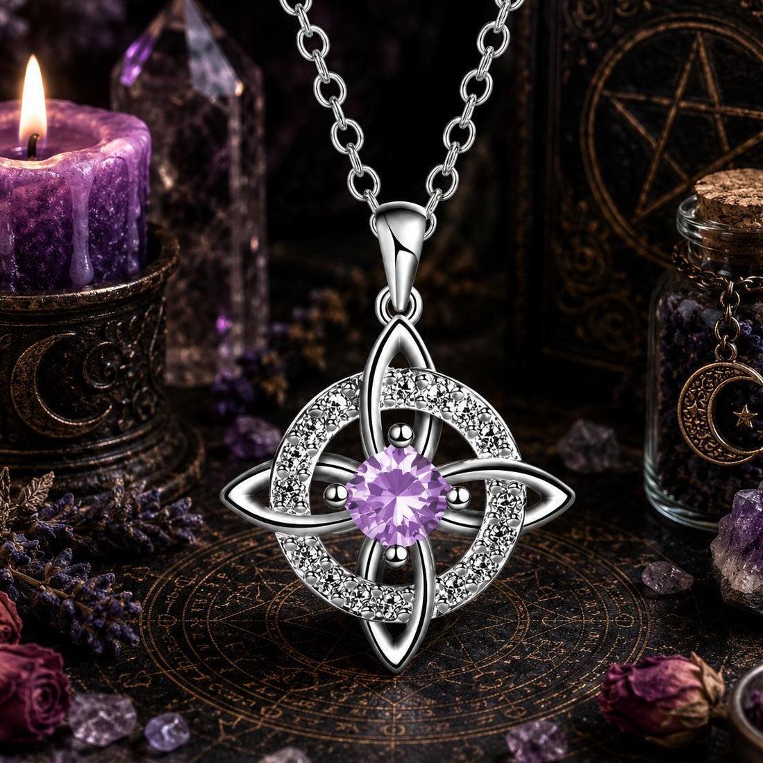 Celtic Witch Knot pendant necklace with purple gem, witchcraft jewelry on altar with candle & crystals