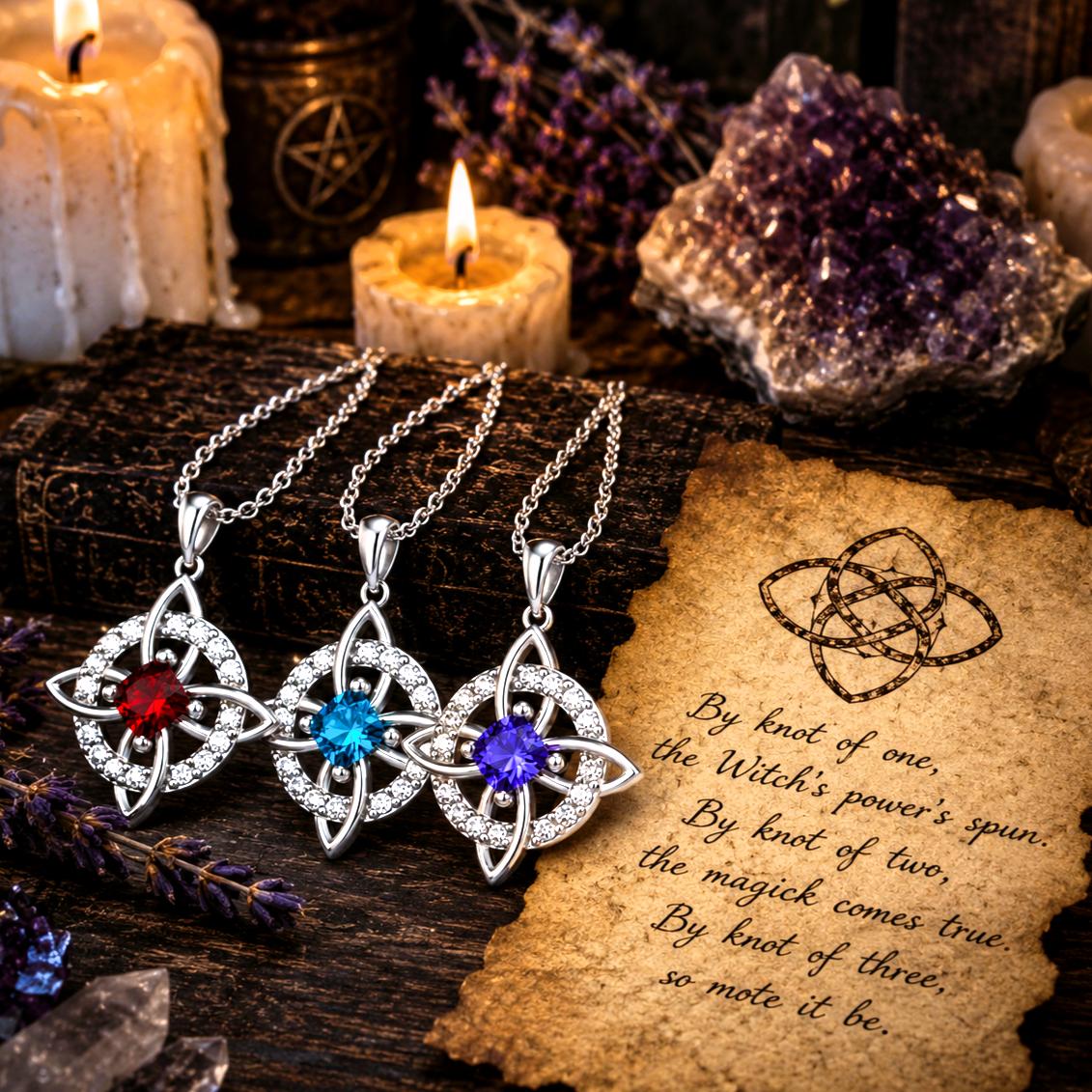 Three sterling silver Witch Knot necklaces with red, blue, and purple zirconia birthstones on chains.
