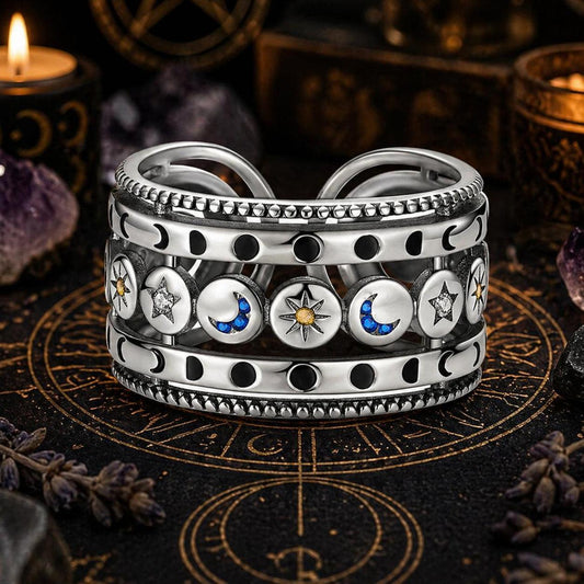 Sterling silver open ring with sun, moon, and stars, featuring blue and yellow accents.