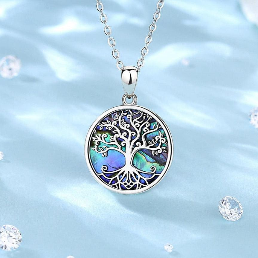 Luxurious sterling silver Abalone Shell Tree of Life necklace with iridescent blue-green pagan jewelry pendant.