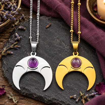 Amethyst crescent moon necklaces shown in silver-tone and gold-tone finishes in a witchy altar setting