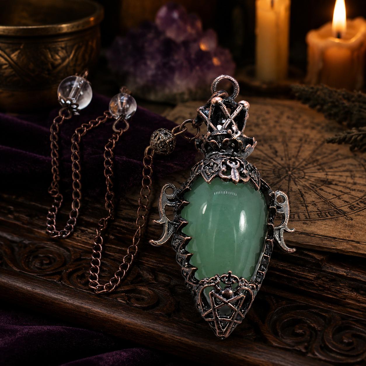 Aventurine chain water drop crystal pendulum on a Pagan ritual altar