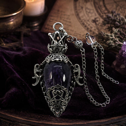 Amethyst crystal chain 1 water drop pendulum on a Pagan ritual altar