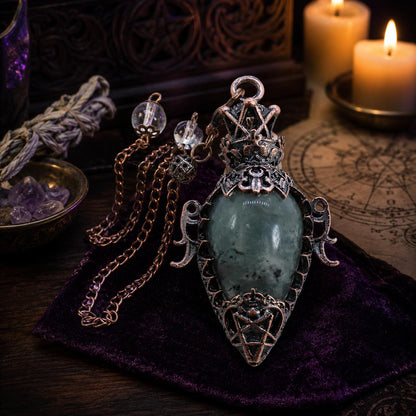 Labradorite chain water drop crystal pendulum on a Pagan ritual altar