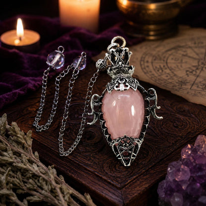 Rose quartz chain 1 water drop crystal pendulum on a Pagan ritual altar