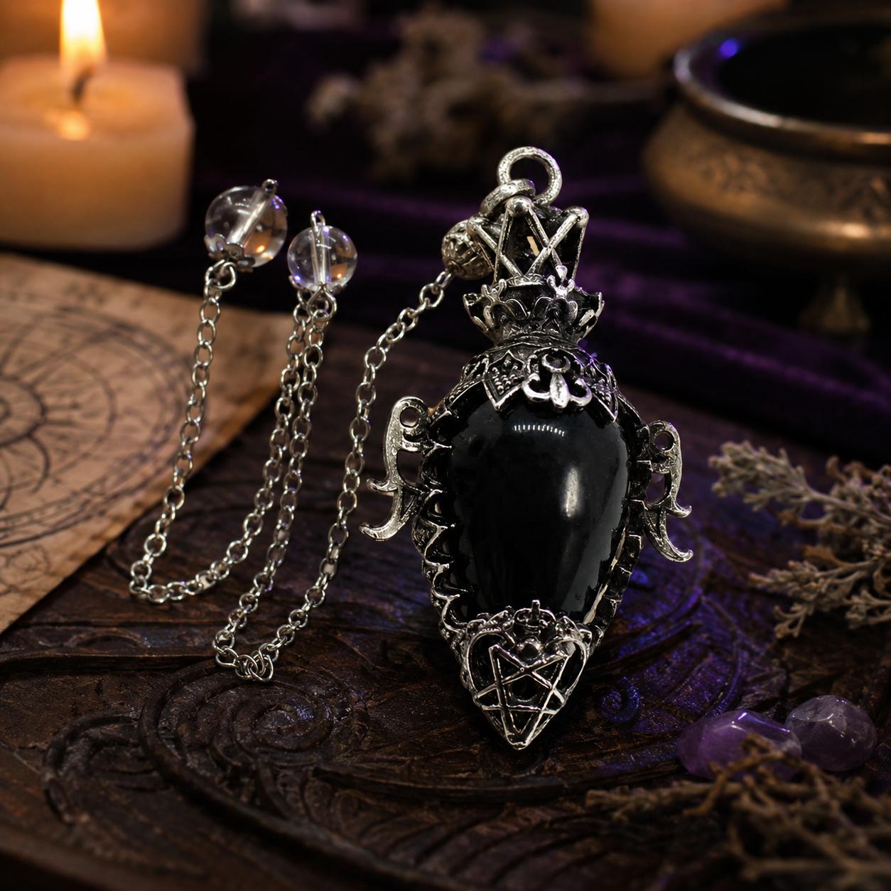 Black agate chain 1 water drop crystal pendulum on a Pagan ritual altar