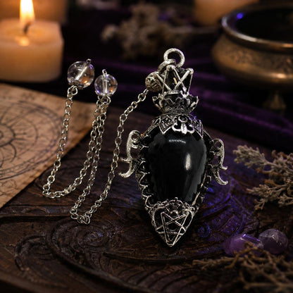 Black agate chain 1 water drop crystal pendulum on a Pagan ritual altar