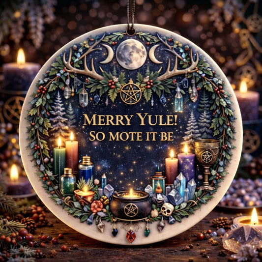 Round ceramic Yule ornament with "Merry Yule! So Mote It Be," surrounded by antlers, moon, candles, and crystals.