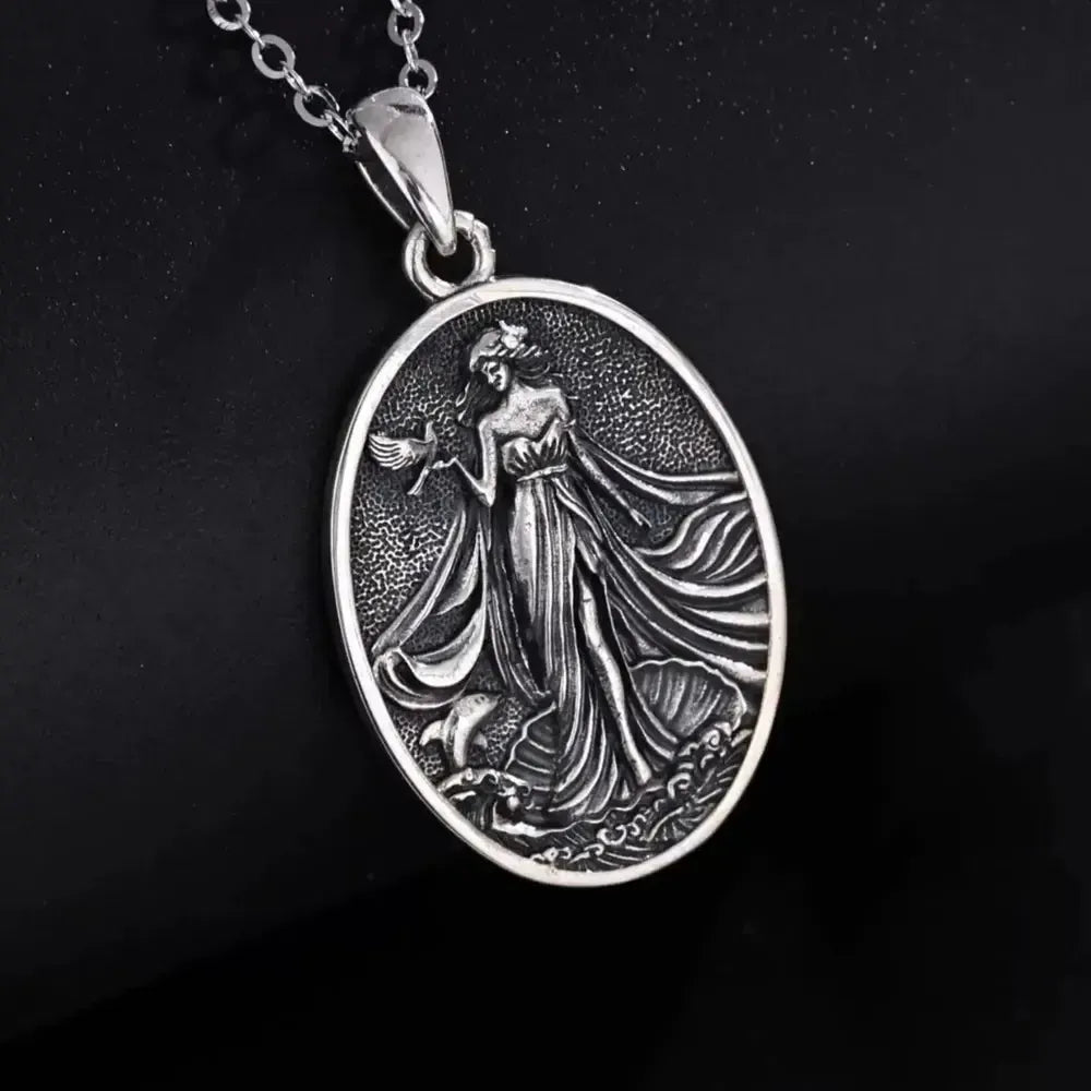 Aphrodite relief necklace displayed on a dark bust