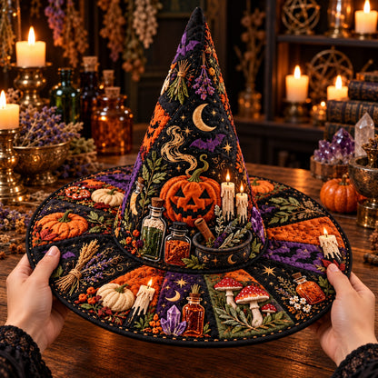Apothecary Quilted Witch Hat – Samhain Pumpkin Potion Wide Brim Hat – held in both hands