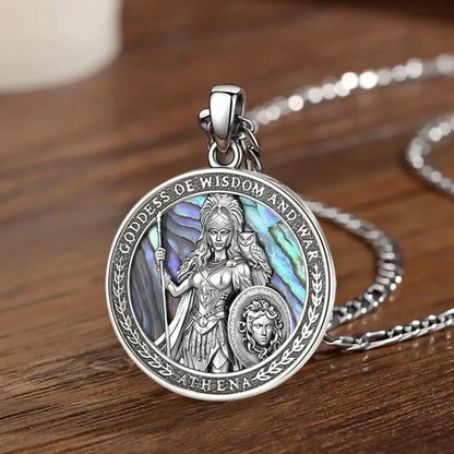 Athena necklace displayed on a wood surface