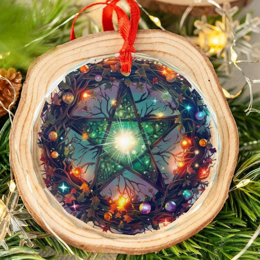 Round wood slice ornament with a clear glass pentagram design, red ribbon, and twinkling lights.