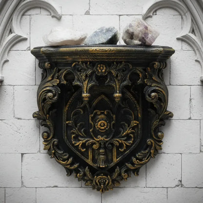 Shield wall shelf – heraldic carved crest detail close-up