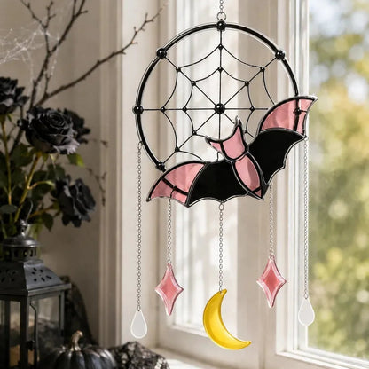 Halloween window hanging styled against a bright window
