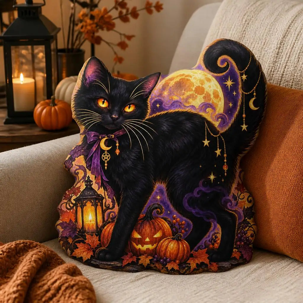 Alternate styled room view: decorative plush pillow featuring cat with moon and pumpkin artwork