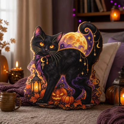 Styled room view: decorative plush pillow featuring cat with moon and pumpkin artwork