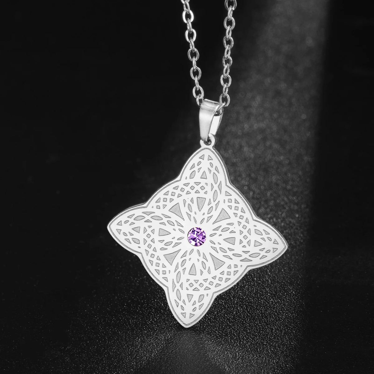 Openwork Celtic pendant backlit to show the cut-through design