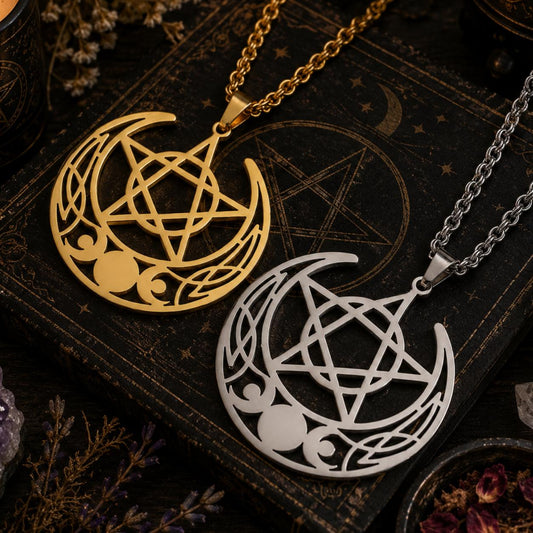 Gold and silver stainless steel Celtic Triple Moon Pentagram necklaces on a dark, mystical book.