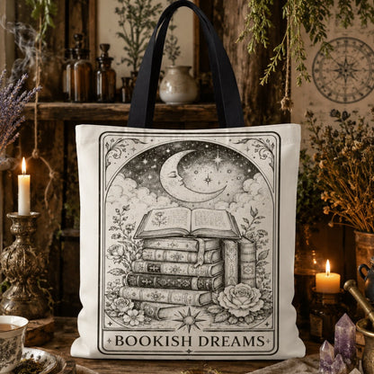 'Bookish Dreams' printed canvas tote bag: a tall stack of books beneath a crescent moon and stars, surrounded by roses.