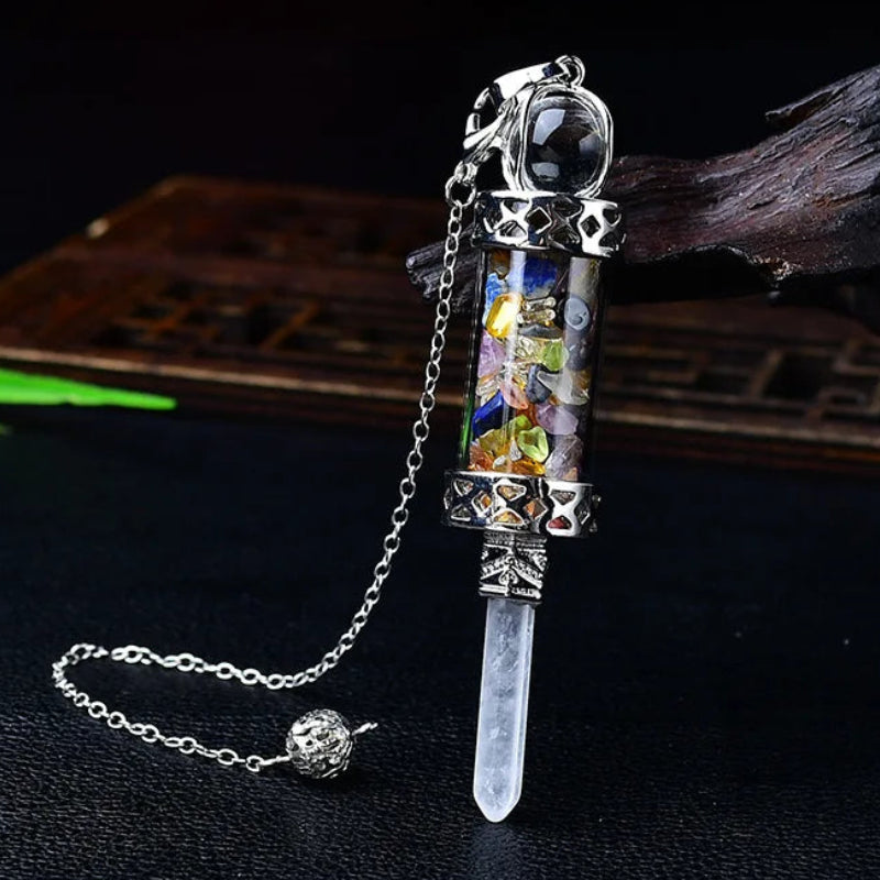 Glass chamber, crystal chips and pointed pendulum with chain: Crystal Chip Glass Bottle Divination Pendulum, featuring a crystal-chip glass bottle with an elongated point and chain.