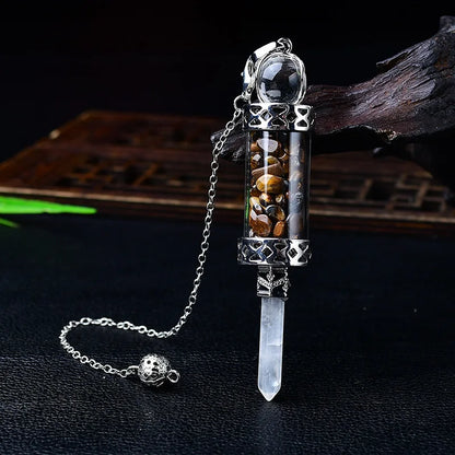 Glass chamber, crystal chips and pointed pendulum with chain: Crystal Chip Glass Bottle Divination Pendulum, featuring a crystal-chip glass bottle with an elongated point and chain.