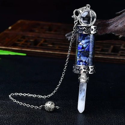 Glass chamber, crystal chips and pointed pendulum with chain: Crystal Chip Glass Bottle Divination Pendulum, featuring a crystal-chip glass bottle with an elongated point and chain.